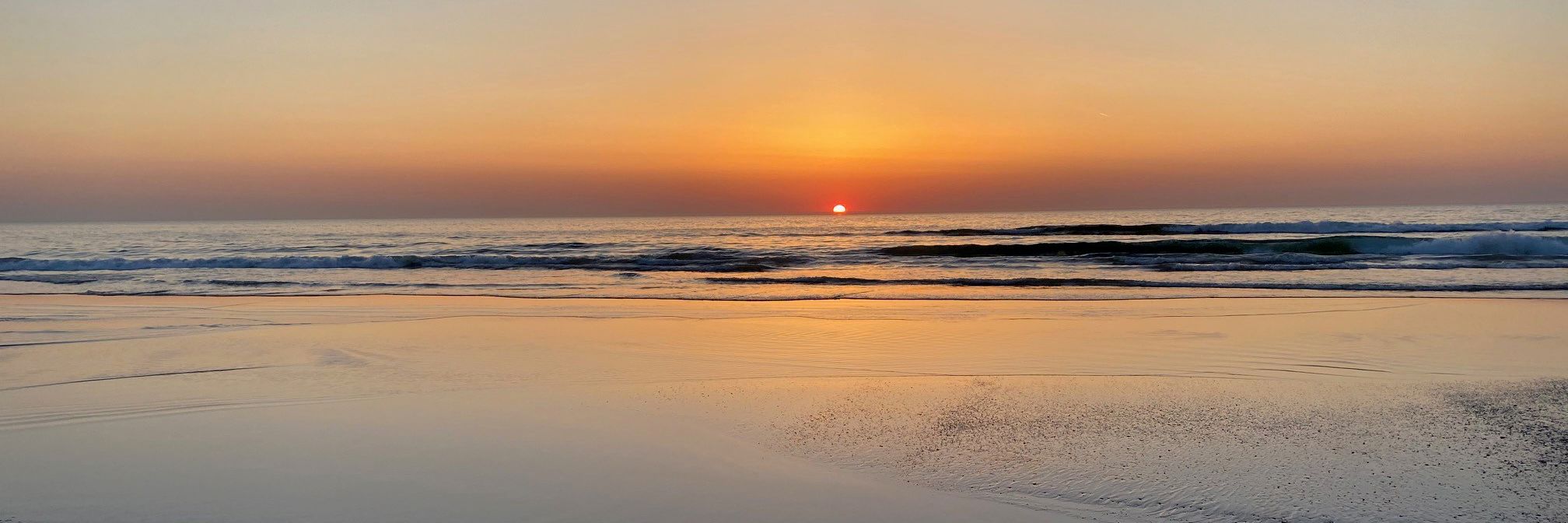 solnedgang over strand