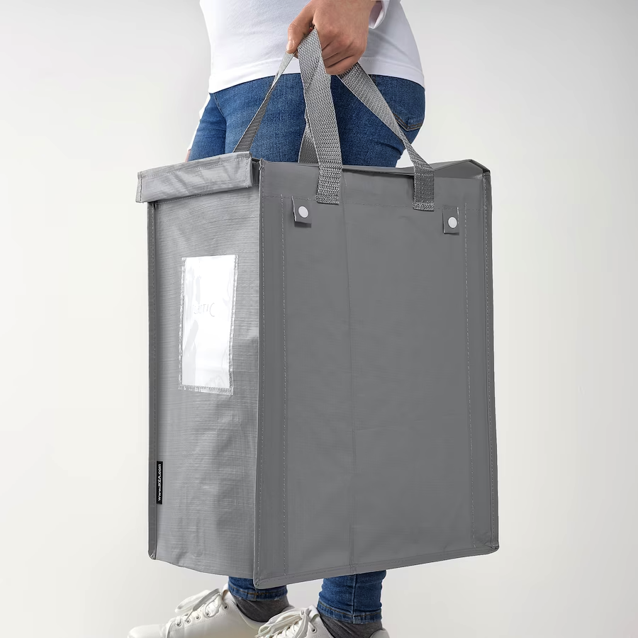 Nylonsæk til sortering løftes